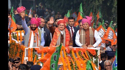 BJP president JP Nadda with Haryana chief minister Manohar Lal Khattar (right) and state party chief Nayab Saini (left) during a roadshow in Panchkula on Saturday. (Sant Arora/HT)