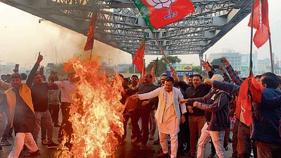 BJP workers protest against the attack on ED officials, in Kolkata on Saturday. (ANI)