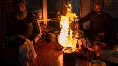 A local prepares 'Harisa' before serving it to customers in Srinagar, Kashmir. (AP) A local prepares 'Harisa' before serving it to customers in Srinagar, Kashmir. (AP)