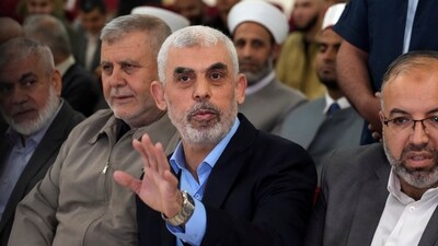 Israel-Hamas War: Yahya Sinwar, head of Hamas in Gaza, greets his supporters upon his arrival at a meeting in a hall on the sea side of Gaza City. (AP) Israel-Hamas War: Yahya Sinwar, head of Hamas in Gaza, greets his supporters upon his arrival at a meeting in a hall on the sea side of Gaza City. (AP)