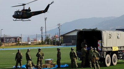 Members of Japan Self-Defense Forces (JSDF) prepare aid supplies to be loaded into a helicopter to take them to isolated villages after the earthquake, in Wajima, Ishikawa Prefecture, Japan on Saturday. (REUTERS)