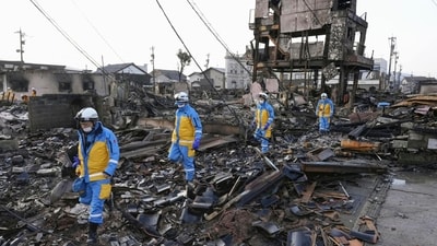 Police officers conduct a search operation at a burnt market in Wajima, Ishikawa prefecture, Japan. (AP) Police officers conduct a search operation at a burnt market in Wajima, Ishikawa prefecture, Japan. (AP)