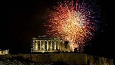Fireworks explode over the ancient Parthenon temple at the Acropolis hill during New Year's celebrations in Athens, Greece, Monday, Jan. 1, 2024. (AP Photo/Yorgos Karahalis) (AP) Fireworks explode over the ancient Parthenon temple at the Acropolis hill during New Year's celebrations in Athens, Greece, Monday, Jan. 1, 2024. (AP Photo/Yorgos Karahalis) (AP)