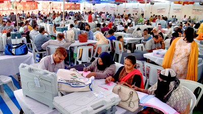 Polling officials collect EVMs and other polling materials. (PTI/File) Polling officials collect EVMs and other polling materials. (PTI/File)