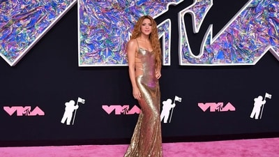 Colombian singer Shakira arrives for the MTV Video Music Awards at the Prudential Center. Shakira made heads turn on the pink carpet in a golden slip gown featuring backless detailing and a floor-sweeping train on the back. Her goddess-like locks accentuated the look. (AFP) Colombian singer Shakira arrives for the MTV Video Music Awards at the Prudential Center. Shakira made heads turn on the pink carpet in a golden slip gown featuring backless detailing and a floor-sweeping train on the back. Her goddess-like locks accentuated the look. (AFP)