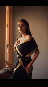 Chhillar in a black Chanderi silk saree with allover stripes and zari border from Vidhi Singhania. Chhillar in a black Chanderi silk saree with allover stripes and zari border from Vidhi Singhania.