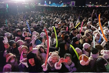 Revellers take part in a disco dance