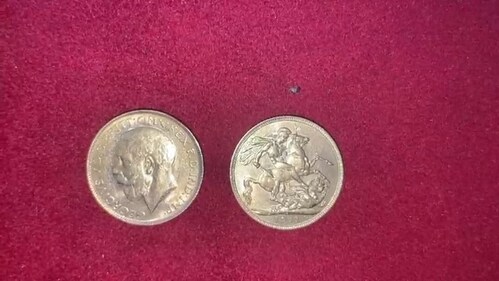 The British-era coins, which bear an engraving of King George V and weigh 7.98 grams each. They are believed to have been minted in 1922. (Maulik Pathak) The British-era coins, which bear an engraving of King George V and weigh 7.98 grams each. They are believed to have been minted in 1922. (Maulik Pathak)