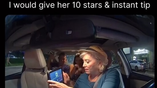 The image shows the cab driver interacting with her passengers. (Instagram/@goodnews_movement)
