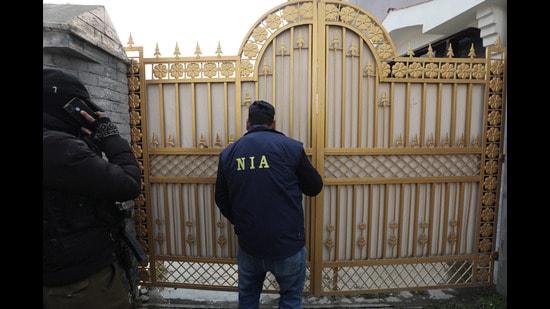 National Investigation Agency (NIA) attaches the house of Mushtaq Ahmad in Srinagar, India on 06 January 2024. NIA spokesman said that the property of Mushtaq Ahmad in Chanapora area of Srinagar was attached in recovery of arms and ammunition case. In the past many houses have been attached by the security agencies in Kashmir. (Waseem Andrabi /HT Photo)