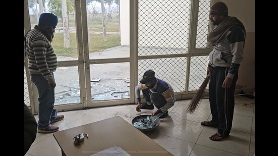 Staff clearing the broken shards of glass after the incident on Friday. (HT FIle)