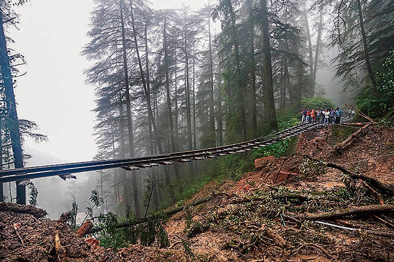 A landslide prompted by incessant rain in Shimla destroys a section of railway track, in August. (PTI) A landslide prompted by incessant rain in Shimla destroys a section of railway track, in August. (PTI)