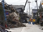 Police officers work in a quake-hit area in Suzu, Ishikawa prefecture, Japan. Police officers work in a quake-hit area in Suzu, Ishikawa prefecture, Japan.