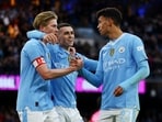 Manchester City's Kevin De Bruyne, Phil Foden and Matheus Nunes celebrates their fifth goal, scored by Jeremy Doku
