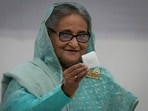 Bangladesh Prime Minister Sheikh Hasina shows her ballot paper as she casts her vote in Dhaka, Bangladesh Bangladesh Prime Minister Sheikh Hasina shows her ballot paper as she casts her vote in Dhaka, Bangladesh