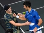 Denmark's Holger Rune (L) and Serbia's Novak Djokovic. Denmark's Holger Rune (L) and Serbia's Novak Djokovic.