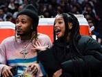 Rapper DDG, left, and singer Halle Bailey watch during the second half of an NBA basketball game between the Los Angeles Clippers and the Golden State Warriors, Thursday, Dec. 14, 2023, in Los Angeles. (AP Photo/Ryan Sun) Rapper DDG, left, and singer Halle Bailey watch during the second half of an NBA basketball game between the Los Angeles Clippers and the Golden State Warriors, Thursday, Dec. 14, 2023, in Los Angeles. (AP Photo/Ryan Sun)