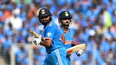 Rohit Sharma (L) and Virat Kohli run between the wicket (AFP) Rohit Sharma (L) and Virat Kohli run between the wicket (AFP)