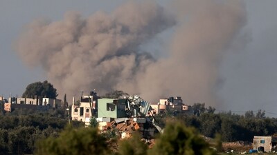 Israel-Hamas War: Smoke billowing from buildings in the Palestinian territory during Israeli bombardment. (AFP) Israel-Hamas War: Smoke billowing from buildings in the Palestinian territory during Israeli bombardment. (AFP)