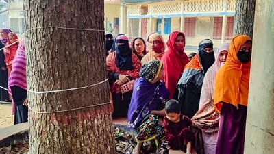 Bangladesh Elections: Voters stand in a queue to cast their vote in the Bangladesh's general elections, at Camilla in Chittagong. (PTI) Bangladesh Elections: Voters stand in a queue to cast their vote in the Bangladesh's general elections, at Camilla in Chittagong. (PTI)