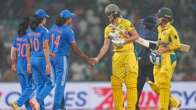 Indian and Australian players greet each other at the end of their 2nd T20I cricket match, at DY Patil stadium (PTI) Indian and Australian players greet each other at the end of their 2nd T20I cricket match, at DY Patil stadium (PTI)