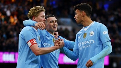 Manchester City's Kevin De Bruyne, Phil Foden and Matheus Nunes celebrates their fifth goal, scored by Jeremy Doku (Action Images via Reuters)