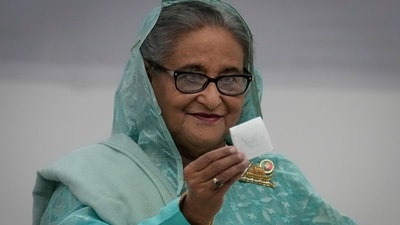 Bangladesh Prime Minister Sheikh Hasina shows her ballot paper as she casts her vote in Dhaka, Bangladesh (AP) Bangladesh Prime Minister Sheikh Hasina shows her ballot paper as she casts her vote in Dhaka, Bangladesh (AP)