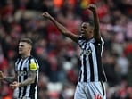 Newcastle United's English defender #02 Kieran Trippier (L) and Newcastle United's Swedish striker #14 Alexander Isak (R) celebrate on the pitch.