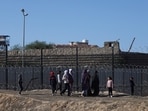 Israel-Hamas War: Displaced Palestinians, who fled their houses due to Israeli strikes, walk as they seek shelter at the border with Egypt, in Rafah in the southern Gaza Strip.
