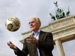 German soccer legend Franz Beckenbauer, head of Germany's organising committee for the soccer World Cup, plays with the Golden Ball for the World Cup in front of the Brandenburg Gate in Berlin, on April 18, 2006