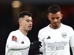 Arsenal's Gabriel Martinelli reacts with Ben White 