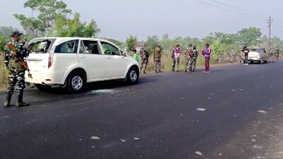 Security personnel stand guard at the site where vehicles of the Enforcement Directorate (ED) team were attacked during a raid in West Bengal's Sandeshkhali. (ANI) Security personnel stand guard at the site where vehicles of the Enforcement Directorate (ED) team were attacked during a raid in West Bengal's Sandeshkhali. (ANI)