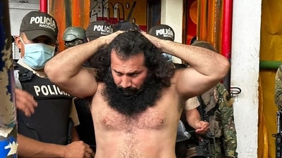 Handout picture released by the Ecuadorean Armed Forces showing Adolfo Macias, aka Fito, leader of the Los Choneros criminal gang, while being transferred to a maximum-security complex in August. (AFP) Handout picture released by the Ecuadorean Armed Forces showing Adolfo Macias, aka Fito, leader of the Los Choneros criminal gang, while being transferred to a maximum-security complex in August. (AFP)