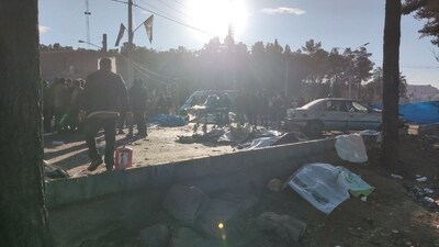 Iran Blasts: People gather at the scene of explosions during a ceremony held to mark the death of late Iranian General Qasem Soleimani, in Kerman. (Reuters)