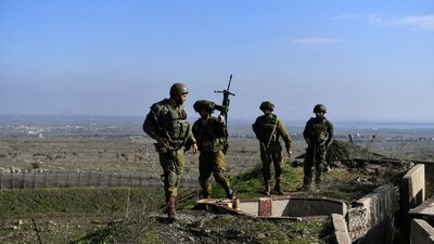 Israeli soldiers operate in the Israeli-occupied Golan Heights near the border with Syria, amid the ongoing conflict between Israel and the Palestinian Islamist group Hamas, December 28.. (Reuters)