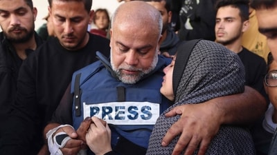 Al Jazeera's bureau chief in Gaza, Wael Al-Dahdouh (C) hugs his daughter during the funeral of his son Hamza Wael Dahdouh, a journalist with the Al Jazeera television network, who was killed in a reported Israeli air strike in Rafah in the Gaza Strip on January 7, 2024. (AFP) Al Jazeera's bureau chief in Gaza, Wael Al-Dahdouh (C) hugs his daughter during the funeral of his son Hamza Wael Dahdouh, a journalist with the Al Jazeera television network, who was killed in a reported Israeli air strike in Rafah in the Gaza Strip on January 7, 2024. (AFP)