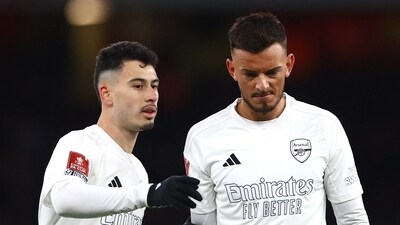 Arsenal's Gabriel Martinelli reacts with Ben White (Reuters)