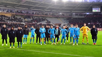 Napoli players look dejected after the match (REUTERS)
