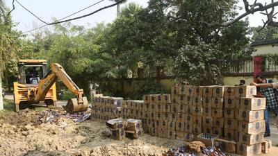 Seized liquor bottles being destroyed in Patna. (HT archive)