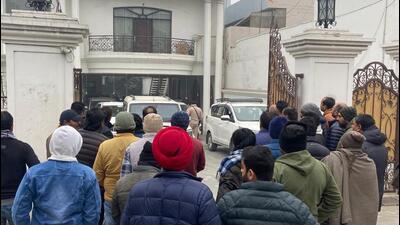 Supporters of former INLD MLA Dilbagh Singh gather outside his house in Yamunanagar as the Enforcement Directorate team prepares to take him for questioning on Monday. (HT Photo) Supporters of former INLD MLA Dilbagh Singh gather outside his house in Yamunanagar as the Enforcement Directorate team prepares to take him for questioning on Monday. (HT Photo)