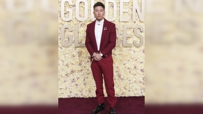 Barry Keoghan made a statement in a Louis Vuitton ensemble from the Spring-Summer 2024 collection, which included a red jacket, red tailored trousers, and a white rounded-collar shirt with pearl buttons. He accessorized the look with a golden belt chain, a pearl necklace, and earrings from Tiffany & Co., adding a touch of sophistication to his outfit. Barry Keoghan made a statement in a Louis Vuitton ensemble from the Spring-Summer 2024 collection, which included a red jacket, red tailored trousers, and a white rounded-collar shirt with pearl buttons. He accessorized the look with a golden belt chain, a pearl necklace, and earrings from Tiffany & Co., adding a touch of sophistication to his outfit.