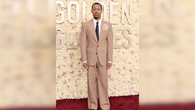 Tyler James Williams wore a striped Dolce & Gabbana suit for the awards show. His taupe suit featured vertical stripes and slightly flared pants, creating a sleek silhouette. The Abbot Elementary star paired the suit with a black tie, a Cartier watch, and a David Yurman necklace and ring. Tyler James Williams wore a striped Dolce & Gabbana suit for the awards show. His taupe suit featured vertical stripes and slightly flared pants, creating a sleek silhouette. The Abbot Elementary star paired the suit with a black tie, a Cartier watch, and a David Yurman necklace and ring. 