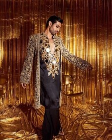 For the sangeet, opt for a mirror work kurta in a dark shade (Photo: Instagram) For the sangeet, opt for a mirror work kurta in a dark shade (Photo: Instagram)