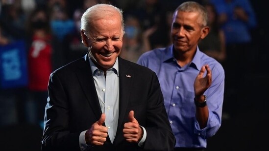 President Joe Biden (left) and former US president Barack Obama (right) (AFP)