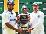 India's skipper Rohit Sharma and South Africa's skipper Dean Elgar pose for a photo with the trophy India's skipper Rohit Sharma and South Africa's skipper Dean Elgar pose for a photo with the trophy