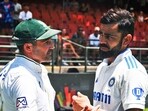 India's Virat Kohli interacts with retiring Dean Elgar after gifting a signed jersey on behalf of Team India after winning the 2nd Test against South Africa by 7 wickets
India's Virat Kohli interacts with retiring Dean Elgar after gifting a signed jersey on behalf of Team India after winning the 2nd Test against South Africa by 7 wickets