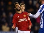 Manchester United's Portuguese midfielder Bruno Fernandes celebrates after scoring against Wigan