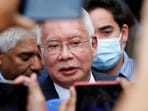 Former Malaysian prime minister Najib Razak speaks to journalists.