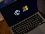 The OpenAI and Microsoft logos on a laptop arranged in Crockett, California, US.