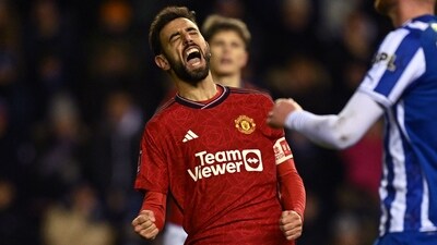 Manchester United's Portuguese midfielder Bruno Fernandes celebrates after scoring against Wigan (AFP) Manchester United's Portuguese midfielder Bruno Fernandes celebrates after scoring against Wigan (AFP)